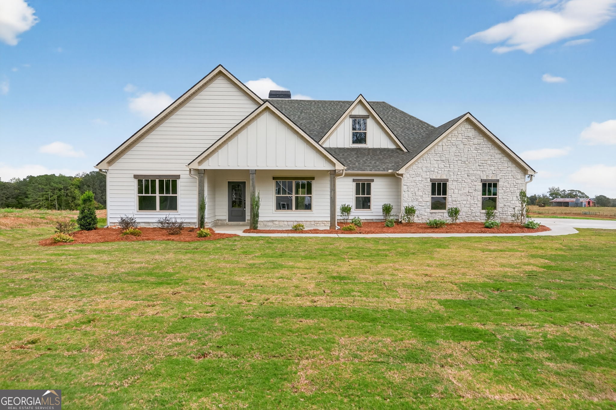 359 Gray Road Roopville, GA 30170 - Photo 2 of 46 a front view of a house with a garden and porch