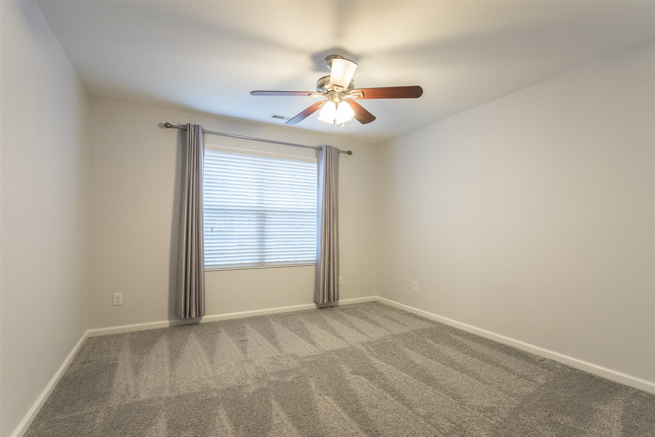 9929 Lynnberry Place Raleigh, NC 27617 - Photo 24 of 30 This lovely bedroom boasts double windows to let in additional lighting and features a ceiling fan with light kit for your convenience and comfort. Bedroom