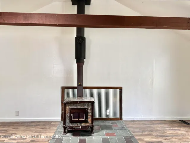 a view of fireplace with wooden floor