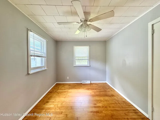 a view of a big room with windows
