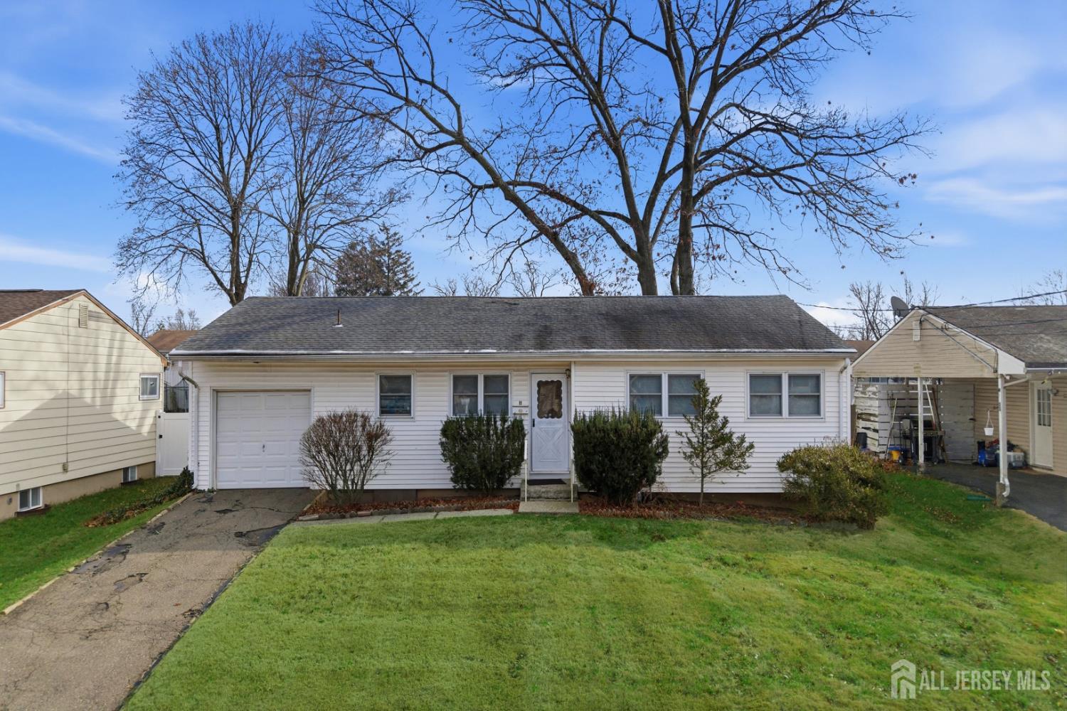 a view of house with yard and front view of a house