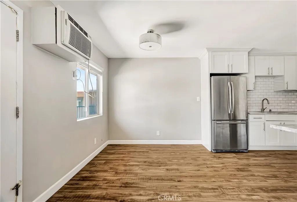 6520 Shirley Reseda, CA 91335 - Photo 16 of 26 a view of a kitchen with a refrigerator cabinets and a window