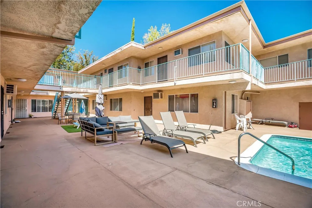 6520 Shirley Reseda, CA 91335 - Photo 24 of 26 a view of a patio with table and chairs with wooden fence