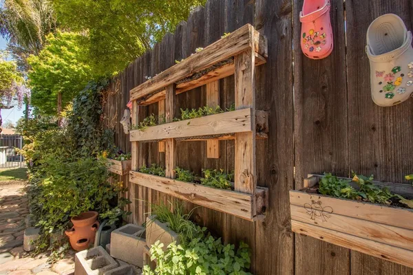 a backyard of a house with table and chairs
