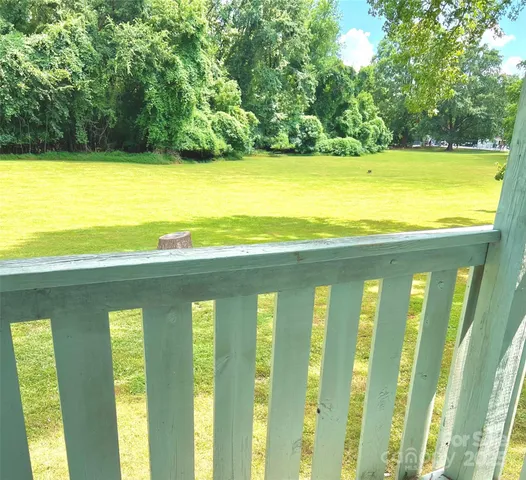 a view of a balcony with an ocean view
