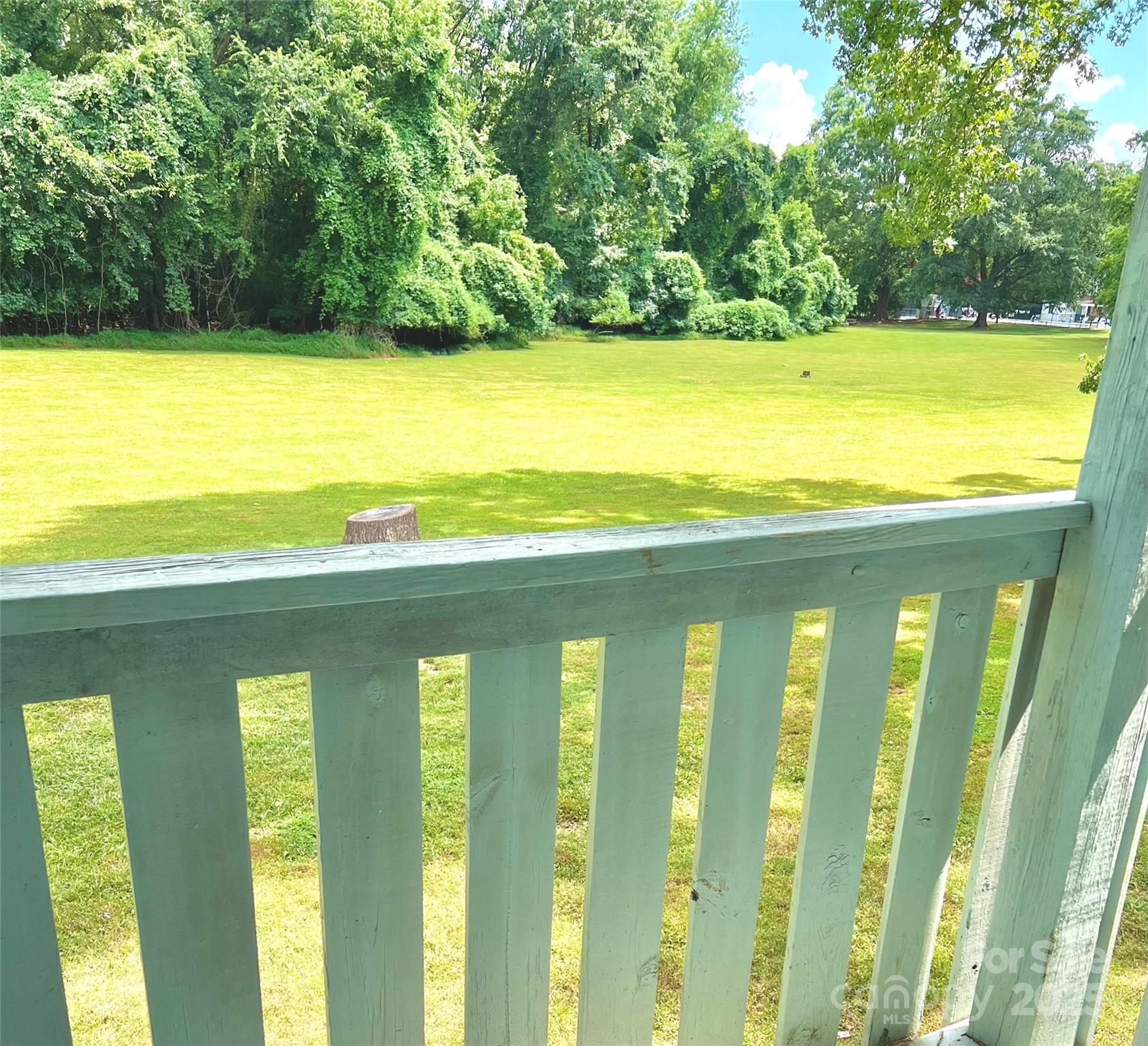 2014 Countrymens Court, Unit 60 Charlotte, NC 28210 - Photo 4 of 9 a view of a balcony with an ocean view