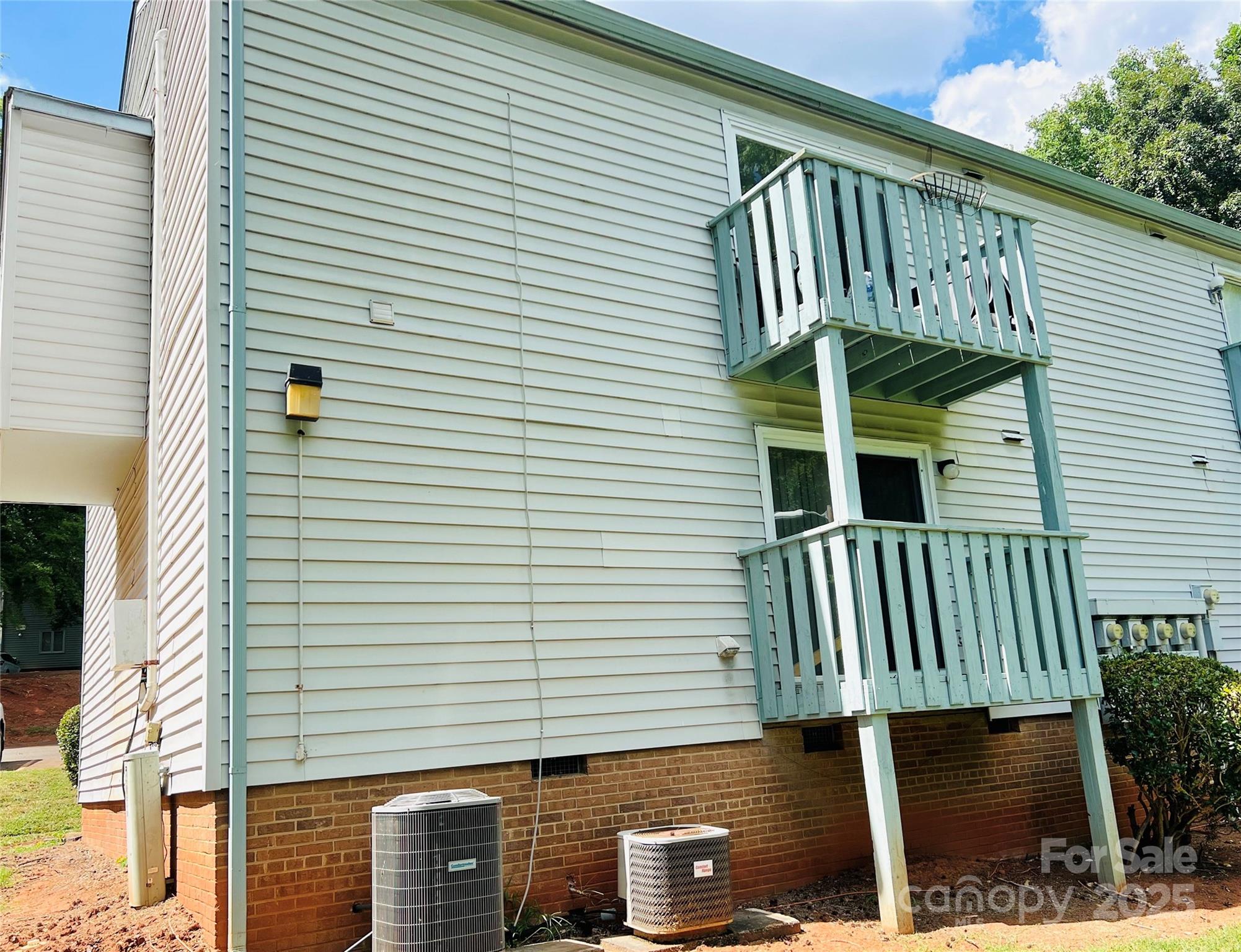 2014 Countrymens Court, Unit 60 Charlotte, NC 28210 - Photo 5 of 9 a view of front door and potted plants