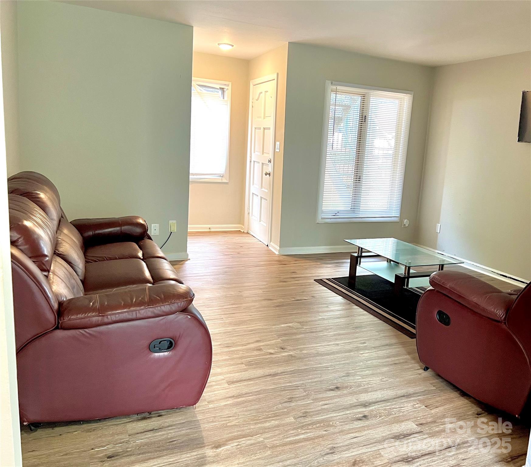 2014 Countrymens Court, Unit 60 Charlotte, NC 28210 - Photo 6 of 9 a living room with furniture and wooden floor
