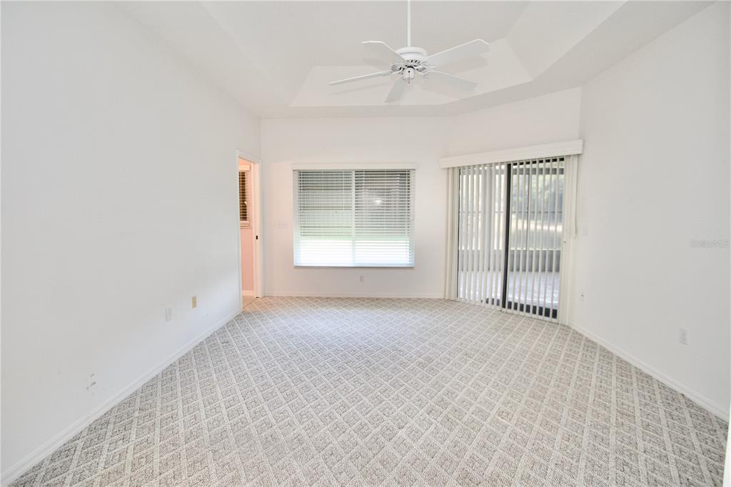 7842 Tenby Court New Port Richey, FL 34655 - Photo 4 of 27 an empty room with windows and closet