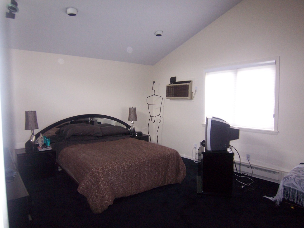 962 Plumb Road Becket, MA 01223 - Photo 4 of 7 a bedroom with a bed and a window