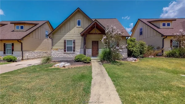 a front view of house with garden