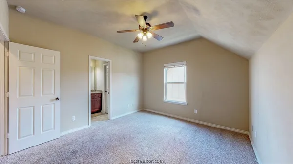 a view of a livingroom with a ceiling fan and window