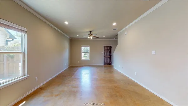 a view of an empty room with a window