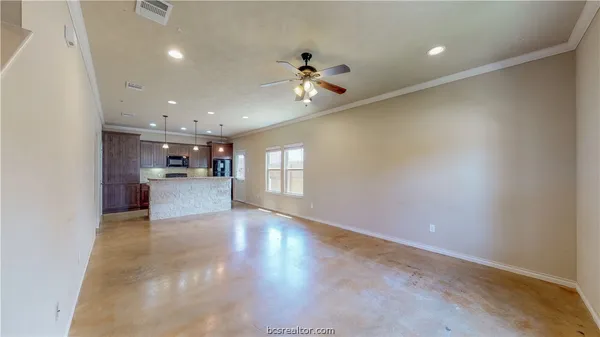 a view of a kitchen with a sink and a window