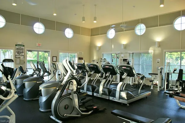 a backyard of a house with a yard and outdoor seating