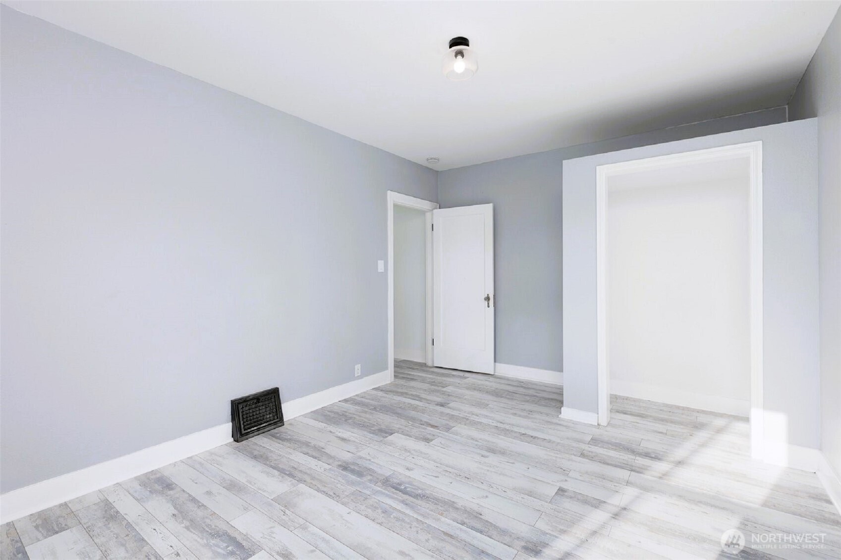 24507 Meridian East Graham, WA 98338 - Photo 17 of 38 a view of an empty room with wooden floor