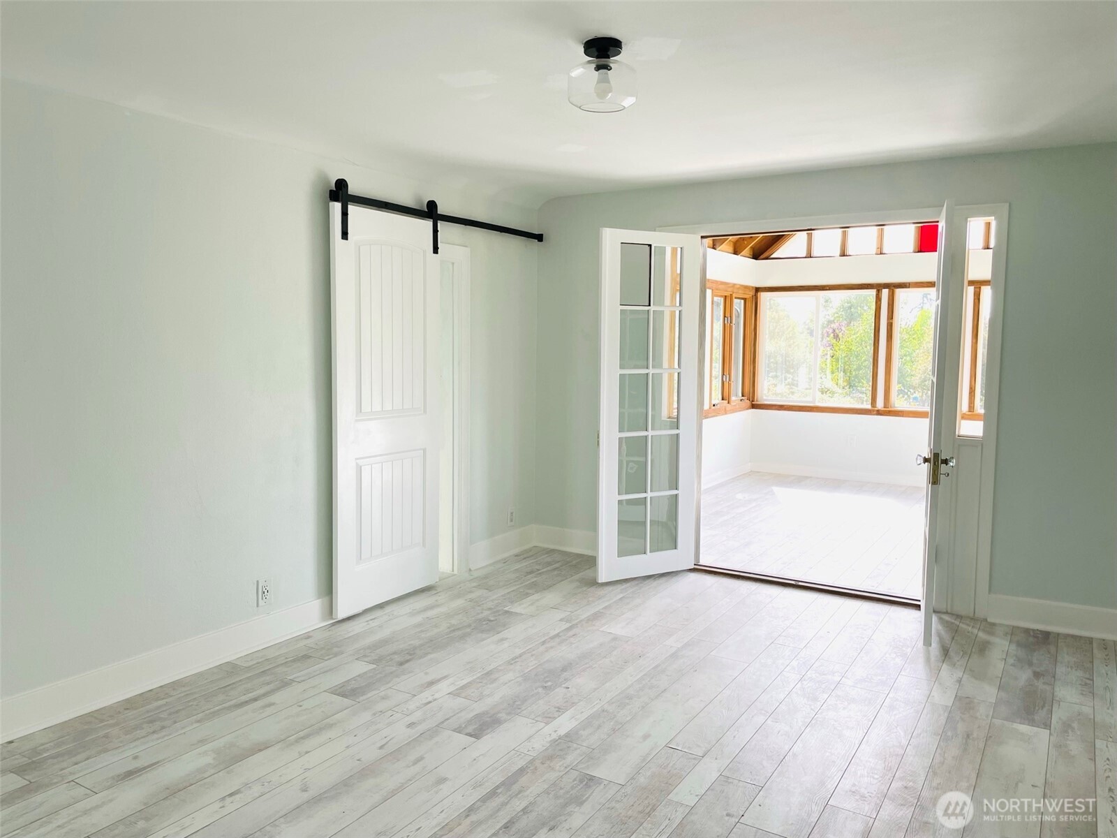24507 Meridian East Graham, WA 98338 - Photo 22 of 38 an empty room with wooden floor and windows