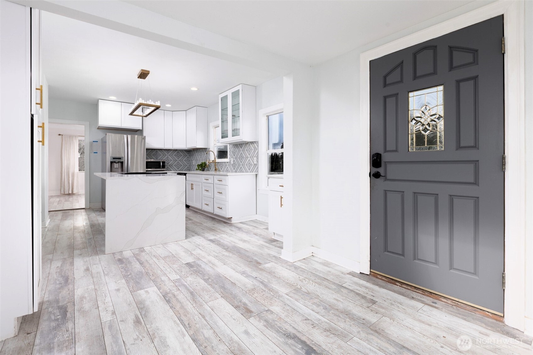 24507 Meridian East Graham, WA 98338 - Photo 3 of 38 a view of a kitchen with wooden floor