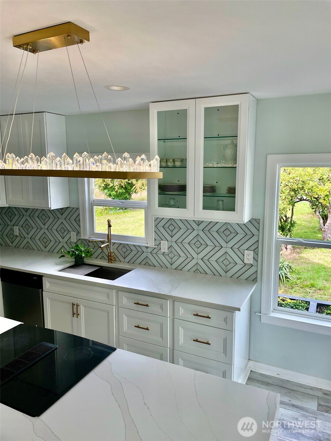 24507 Meridian East Graham, WA 98338 - Photo 9 of 38 a kitchen with a sink and cabinets