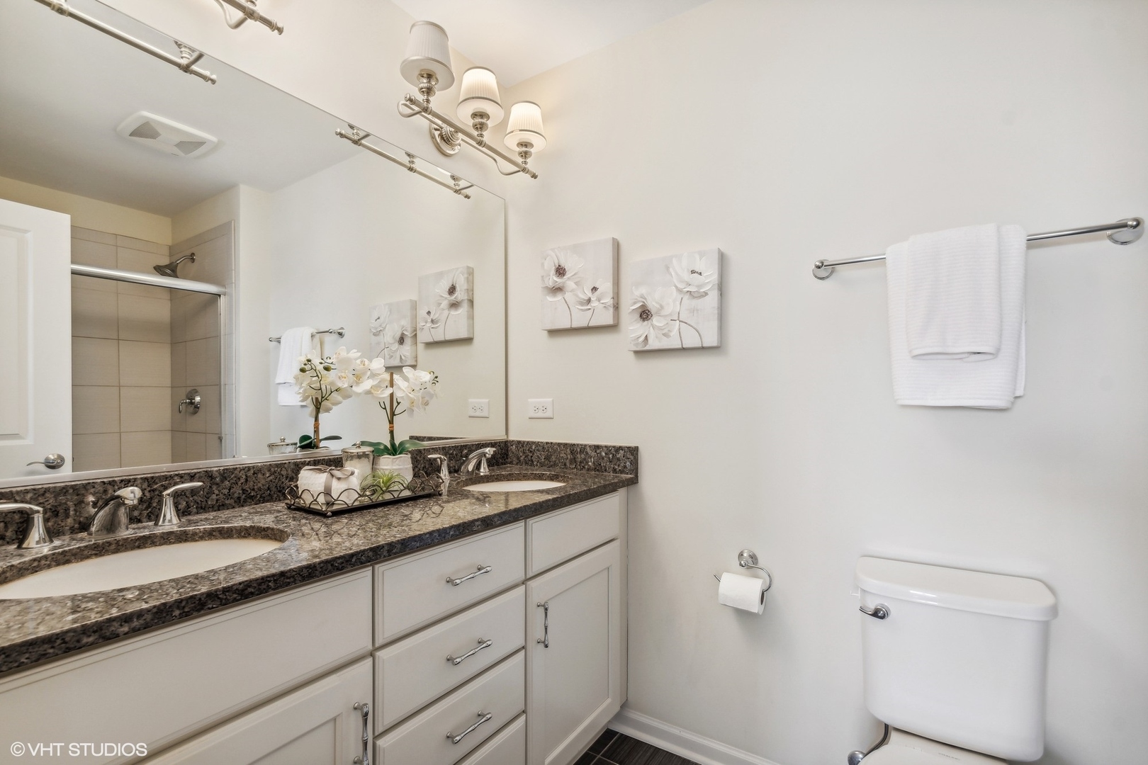 1908 Dauntless Drive Glenview, IL 60026 - Photo 13 of 24 a bathroom with a granite countertop sink a toilet and a mirror