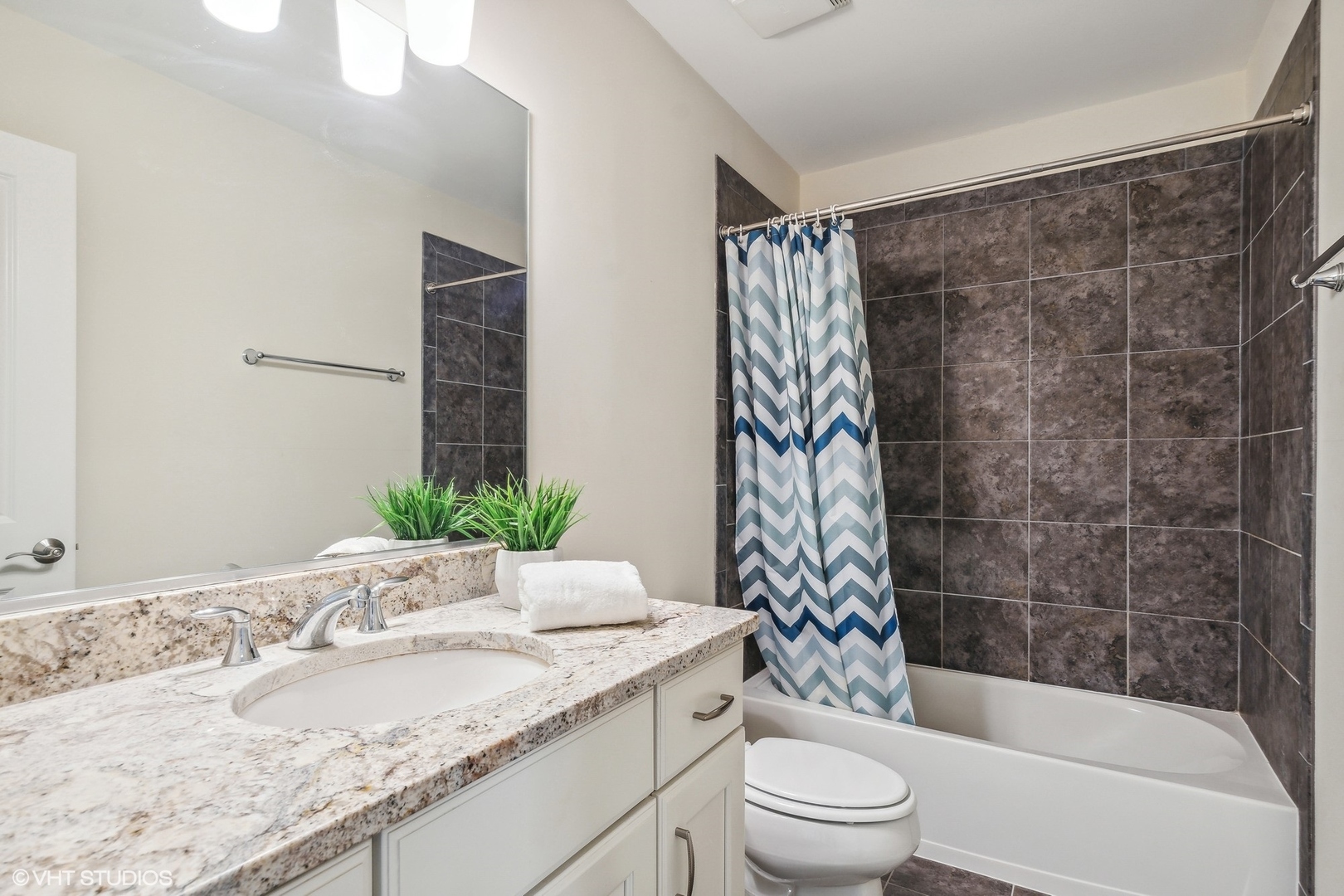 1908 Dauntless Drive Glenview, IL 60026 - Photo 14 of 24 a bathroom with a granite countertop sink toilet and shower