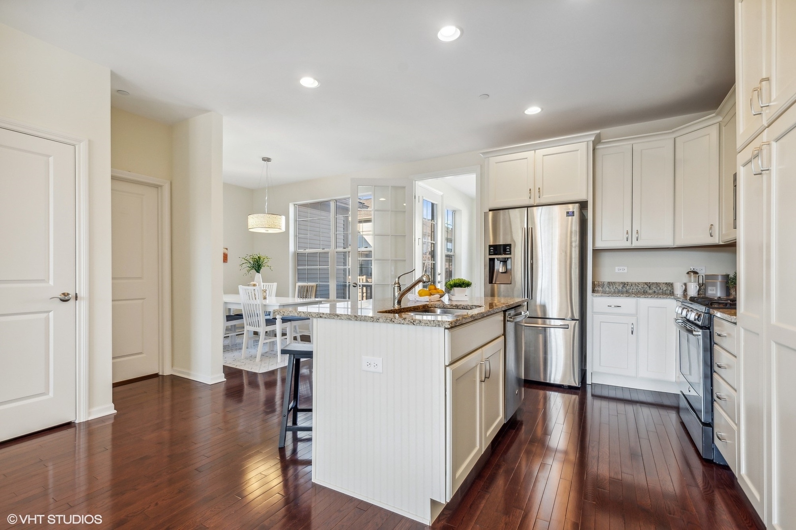 1908 Dauntless Drive Glenview, IL 60026 - Photo 7 of 24 a kitchen with refrigerator a stove and wooden floor