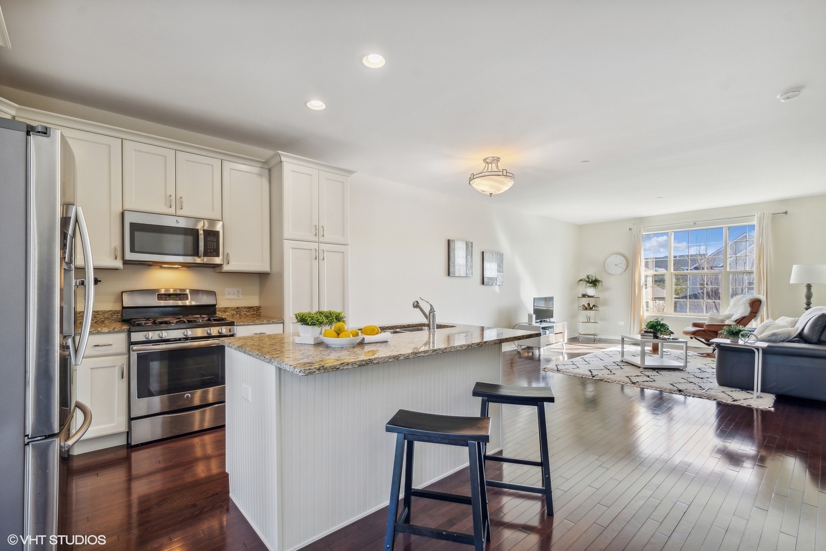 1908 Dauntless Drive Glenview, IL 60026 - Photo 9 of 24 a kitchen with stainless steel appliances a stove a sink a refrigerator cabinets and dining table