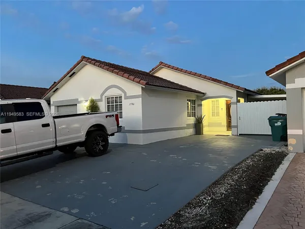 a view of a car in front of a house