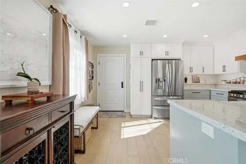 a kitchen with stainless steel appliances a refrigerator and a stove