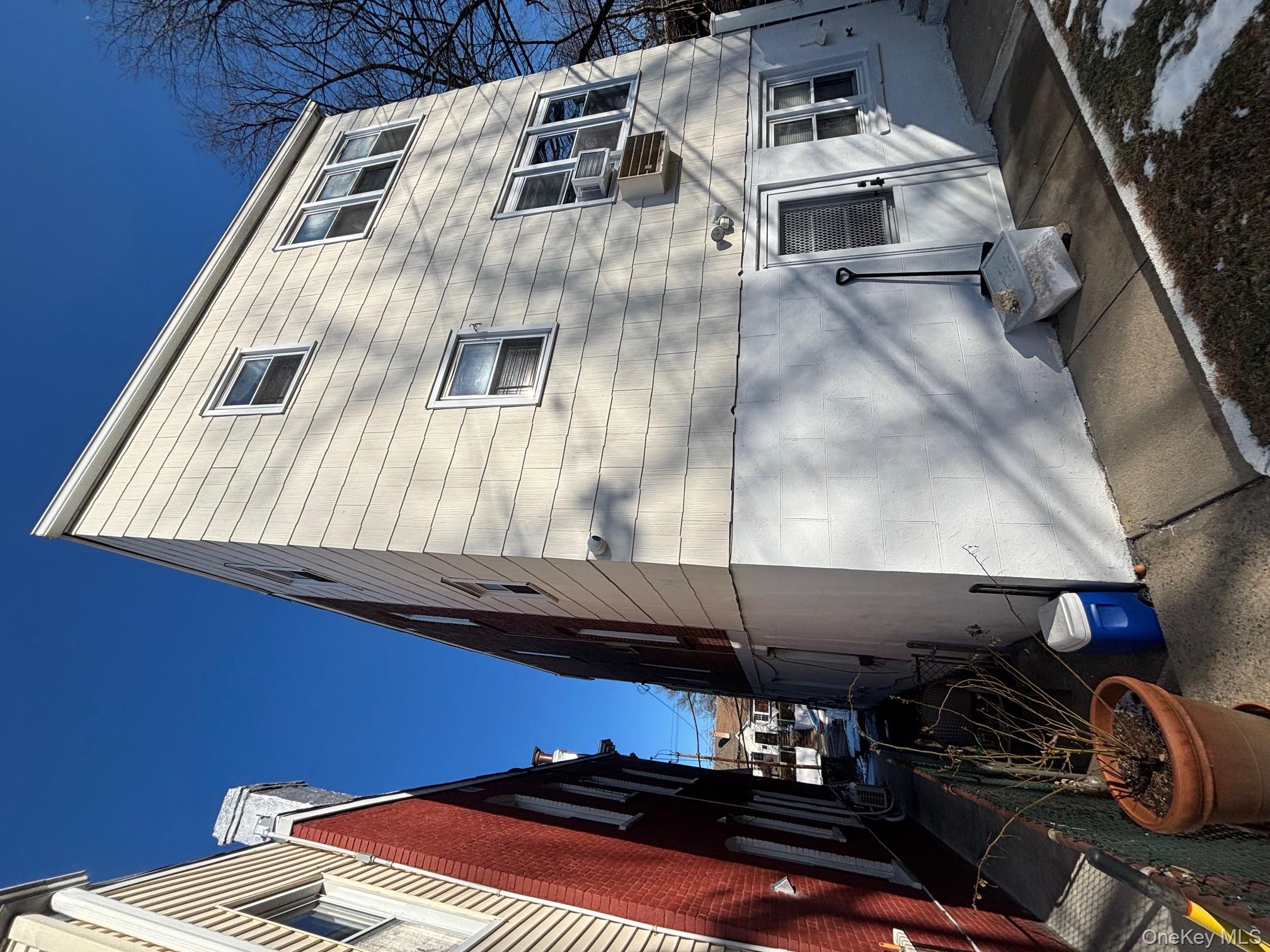 80 Palmer Road Yonkers, NY 10701 - Photo 2 of 12 a view of street along with building