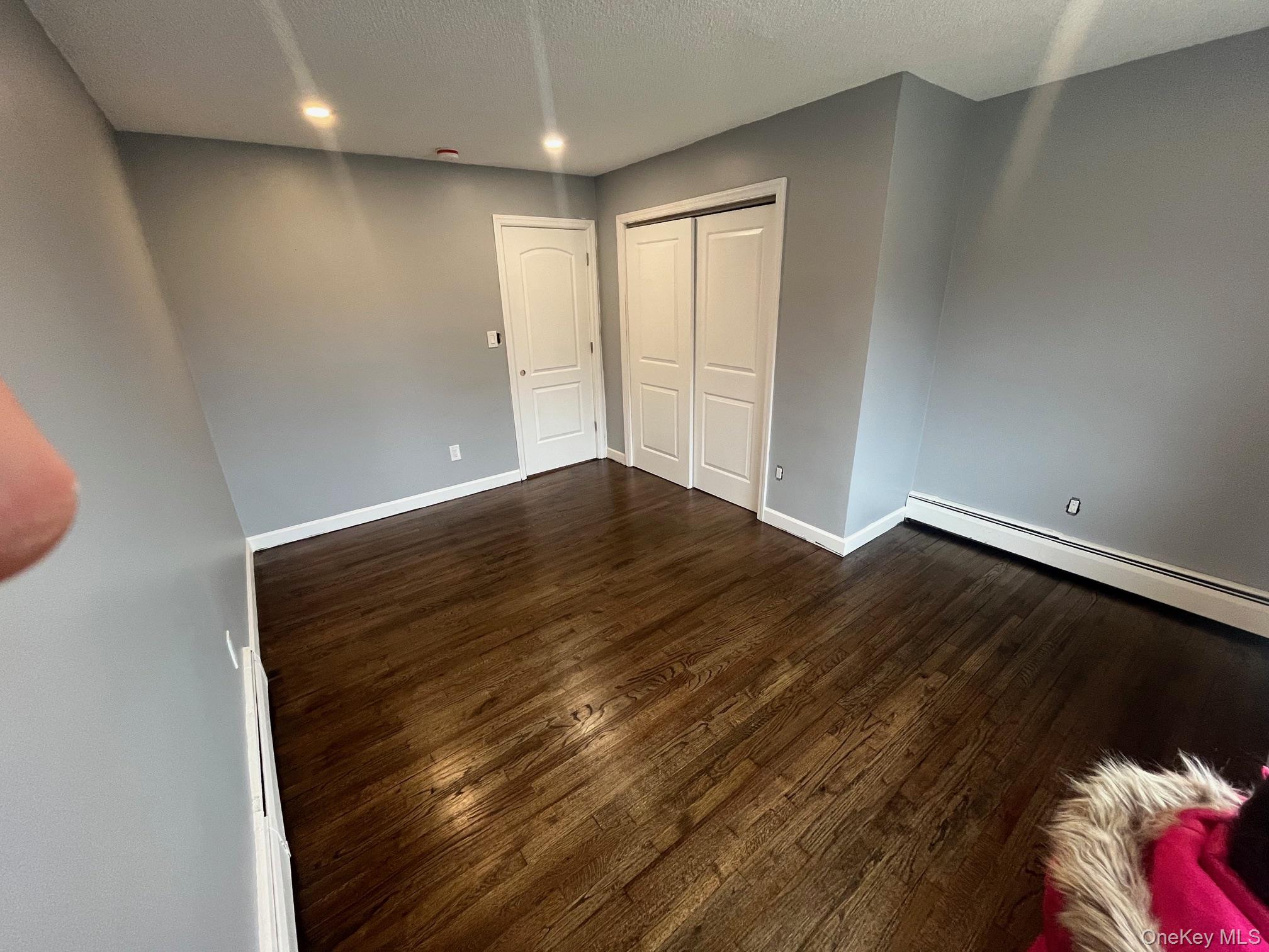 80 Palmer Road Yonkers, NY 10701 - Photo 7 of 12 a view of empty room with wooden floor