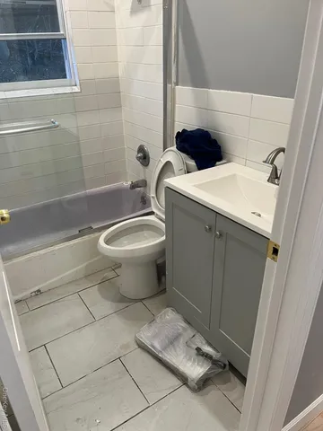 a bathroom with a toilet and a sink