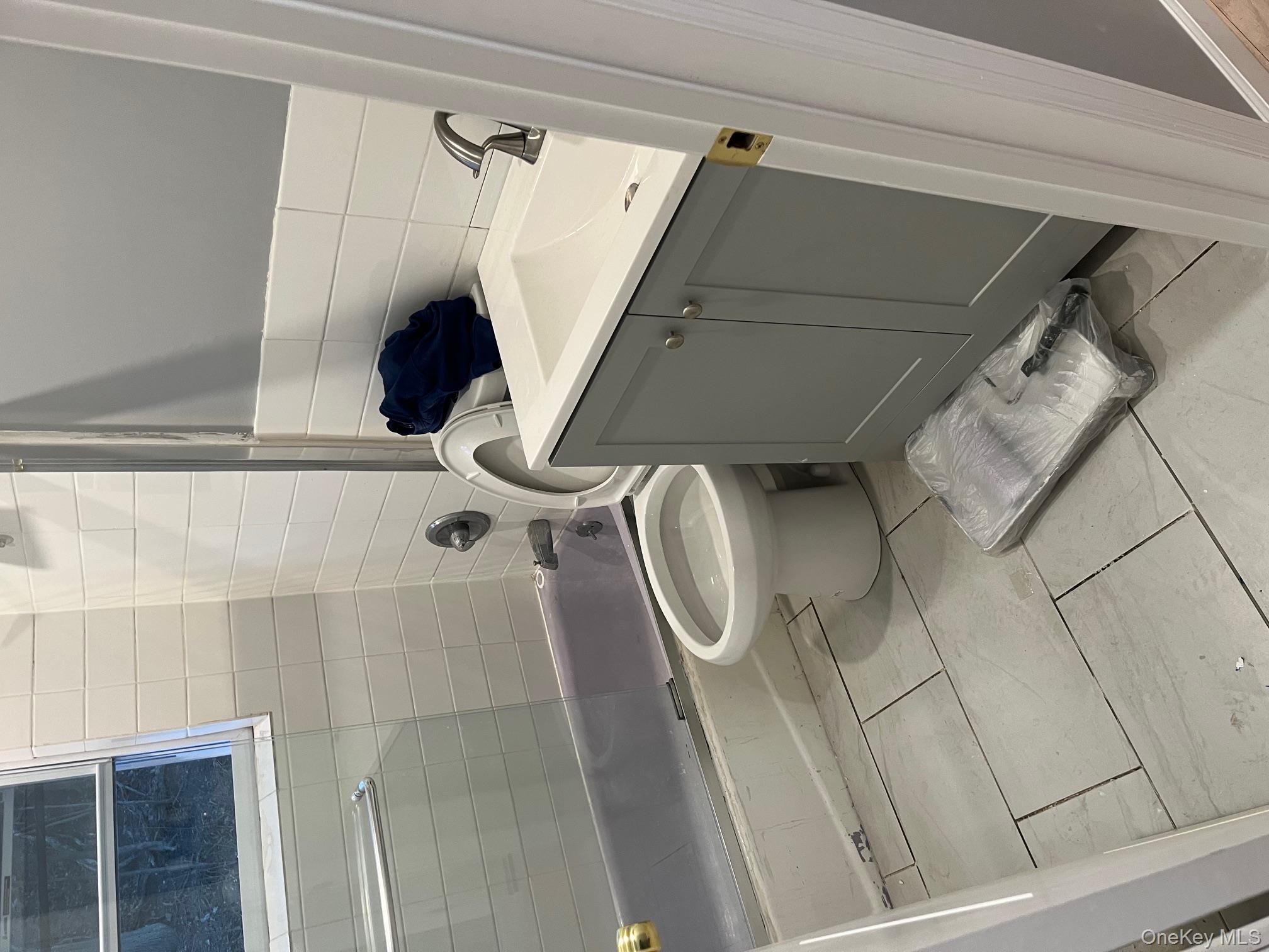 80 Palmer Road Yonkers, NY 10701 - Photo 8 of 12 a bathroom with a toilet and a sink