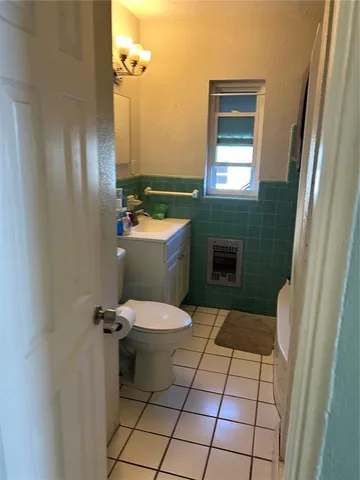 a bathroom with a toilet and a sink