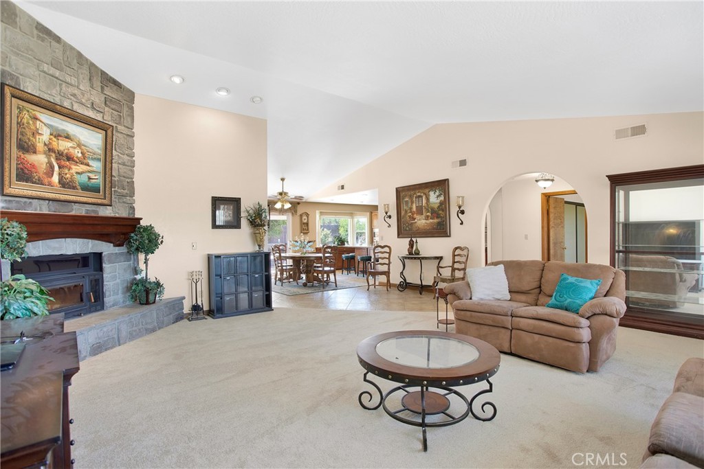 9275 Rattlesnake Road Phelan, CA 92371 - Photo 14 of 68 a living room with fireplace furniture and a large window