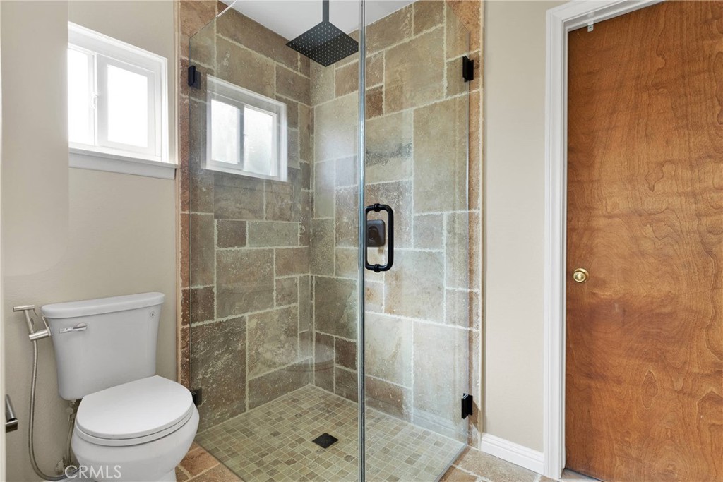 9275 Rattlesnake Road Phelan, CA 92371 - Photo 35 of 68 a bathroom with a toilet and a shower