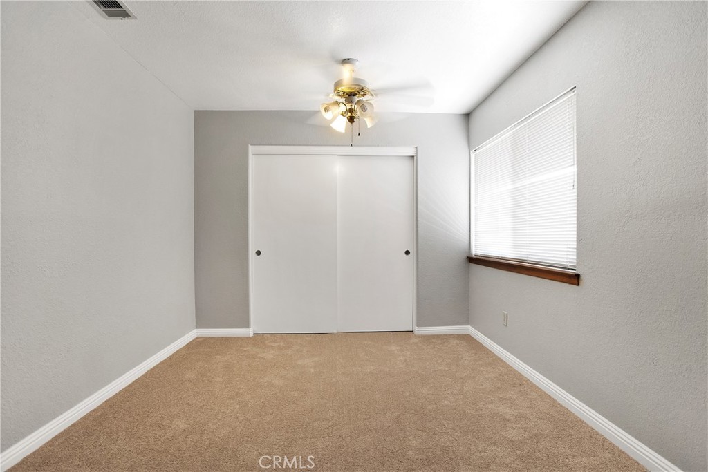 9275 Rattlesnake Road Phelan, CA 92371 - Photo 40 of 68 a view of an empty room with a window