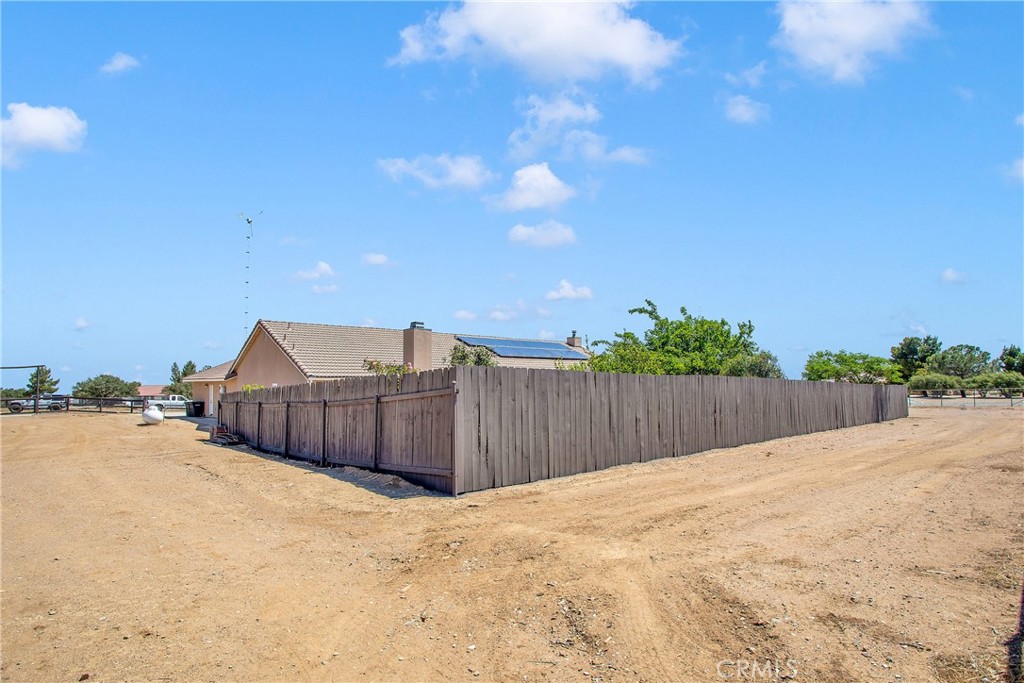 9275 Rattlesnake Road Phelan, CA 92371 - Photo 56 of 68 a view of a house with wooden fence