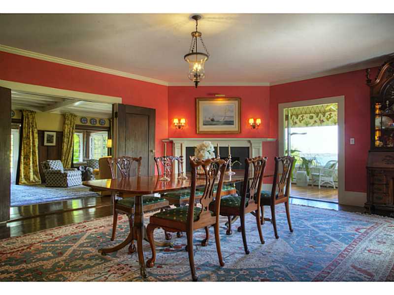 144 Wapping Road Portsmouth, RI 02871 - Photo 13 of 25 Dining Room. Spacious dining room with gas fireplace and large window is open to the living room.