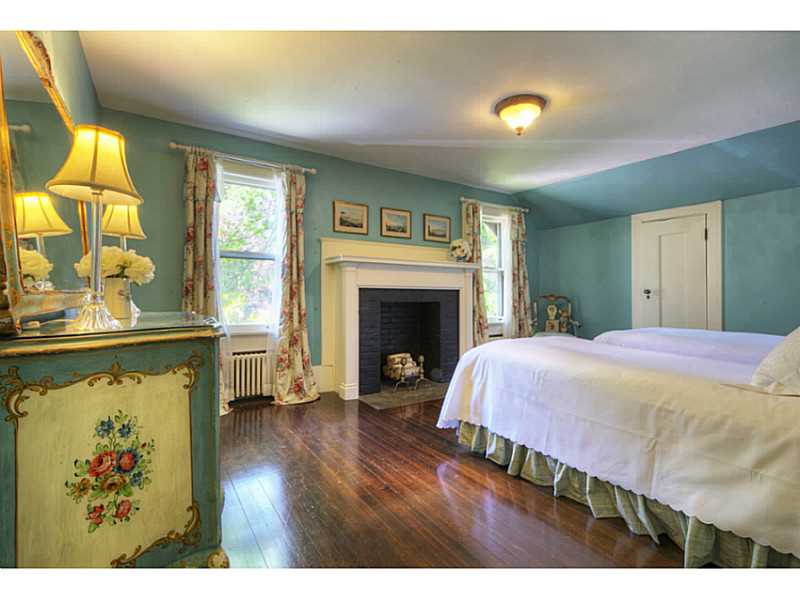 144 Wapping Road Portsmouth, RI 02871 - Photo 18 of 25 Bedroom. Charming guest bedroom with fireplace