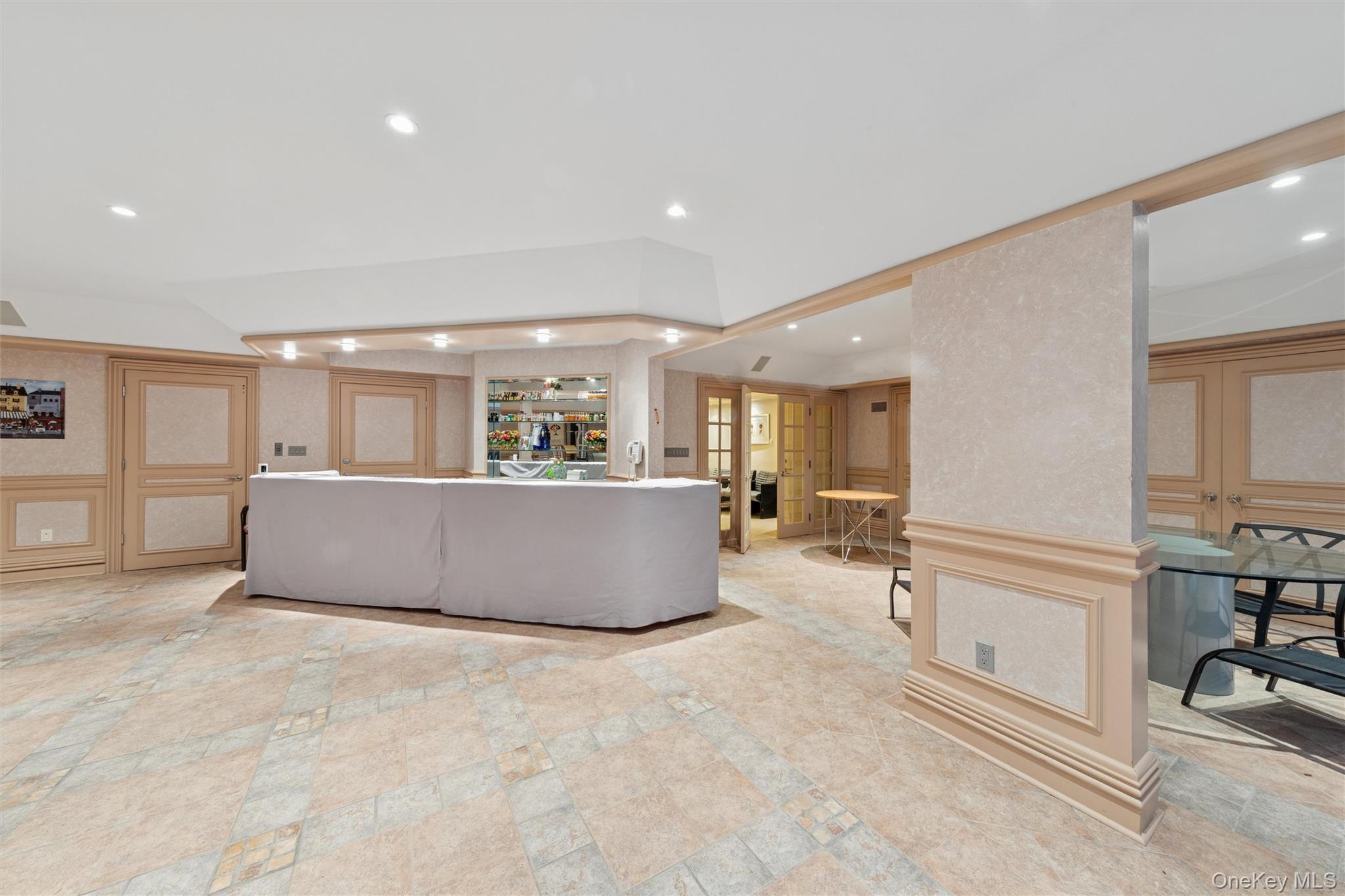22 Willow Road Woodmere, NY 11598 - Photo 19 of 27 a living room with stainless steel appliances furniture and a kitchen view