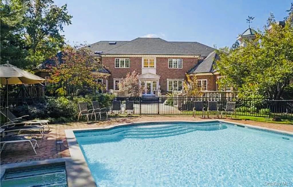 22 Willow Road Woodmere, NY 11598 - Photo 21 of 27 a front view of a house with a yard