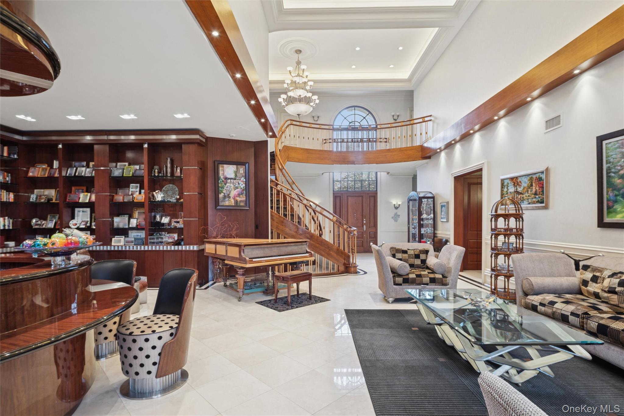 22 Willow Road Woodmere, NY 11598 - Photo 4 of 27 a living room with furniture a rug and a chandelier