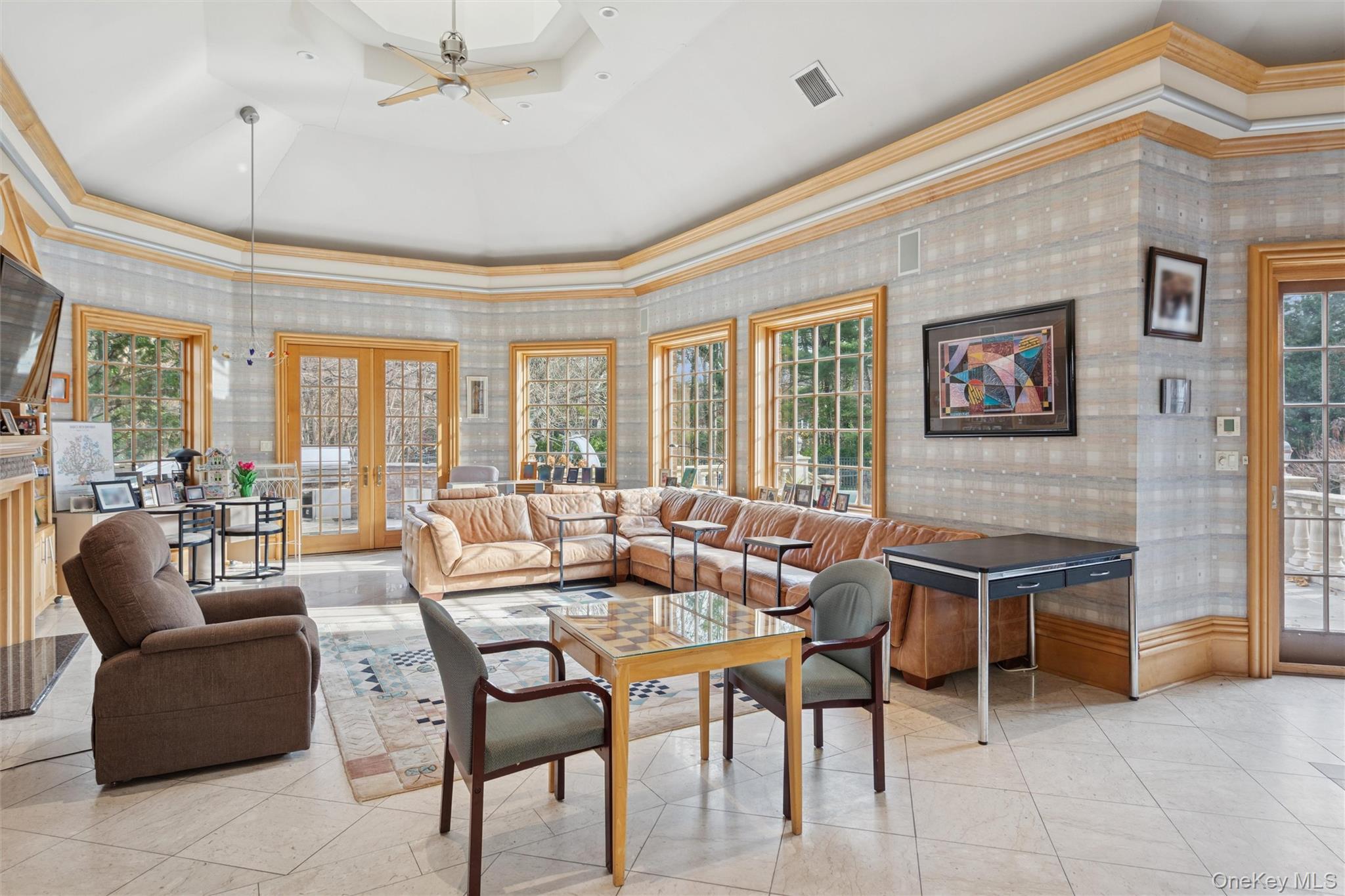 22 Willow Road Woodmere, NY 11598 - Photo 7 of 27 a dining room with furniture a chandelier and a large window