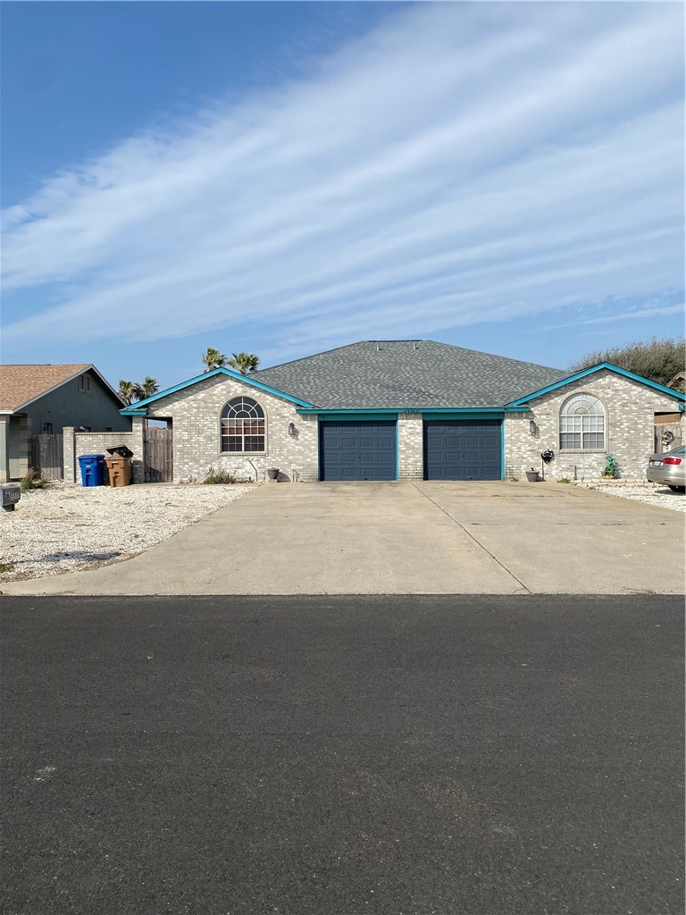 15517 Cruiser Street, Unit B Corpus Christi, TX 78418 - Photo 1 of 25 a view of the house with a street