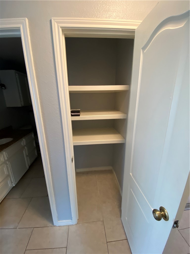 15517 Cruiser Street, Unit B Corpus Christi, TX 78418 - Photo 11 of 25 a storage room with washer and dryer