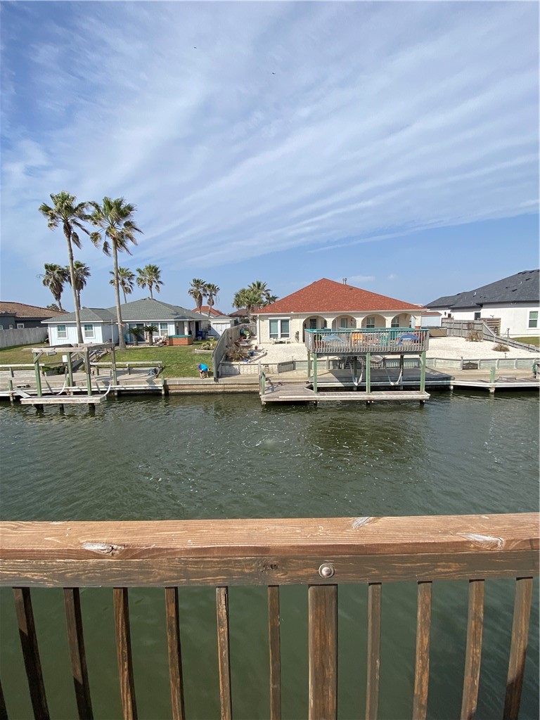 15517 Cruiser Street, Unit B Corpus Christi, TX 78418 - Photo 17 of 25 a view of a lake with houses