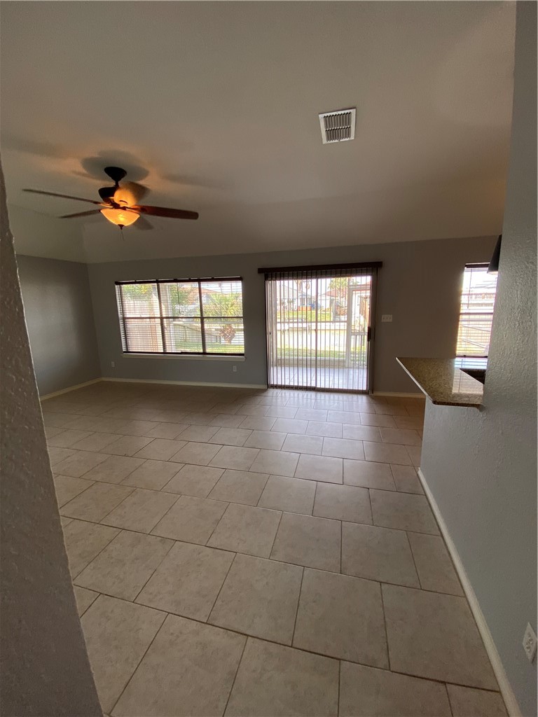 15517 Cruiser Street, Unit B Corpus Christi, TX 78418 - Photo 5 of 25 a view of an empty room with a window