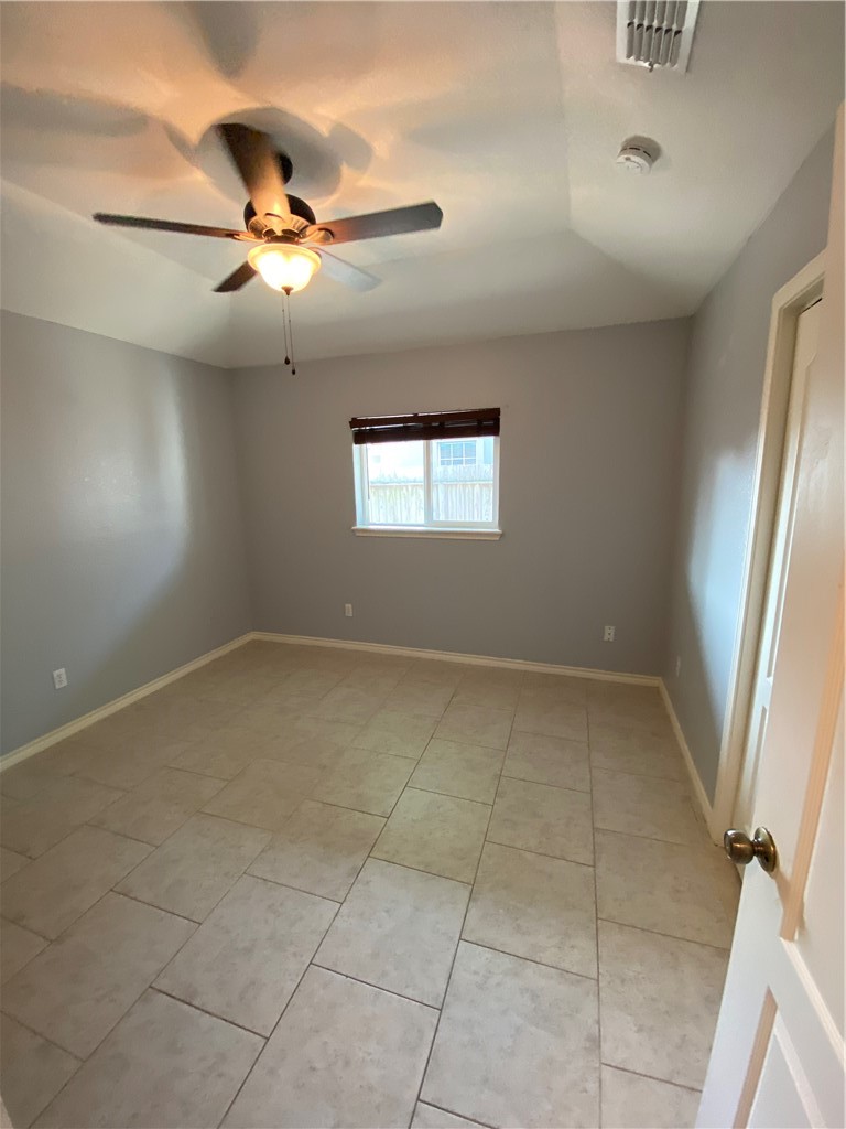 15517 Cruiser Street, Unit B Corpus Christi, TX 78418 - Photo 7 of 25 a view of an empty room with a window