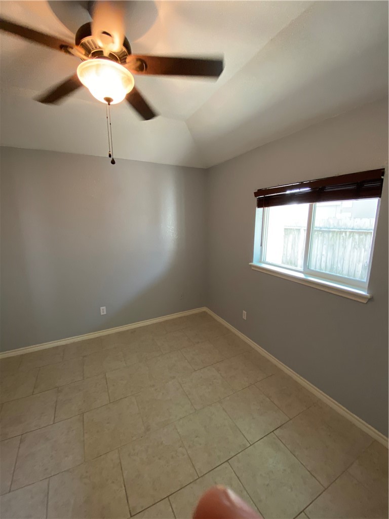 15517 Cruiser Street, Unit B Corpus Christi, TX 78418 - Photo 9 of 25 a view of an empty room with a window